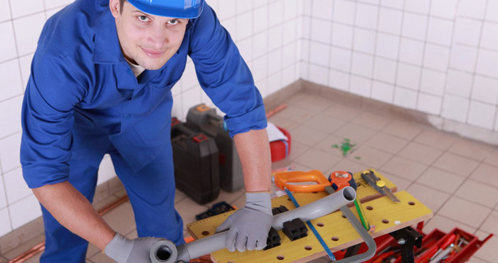 plumber working on new construction