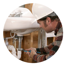 Plumber fixing a sink