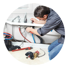 plumber installing a new bathtub